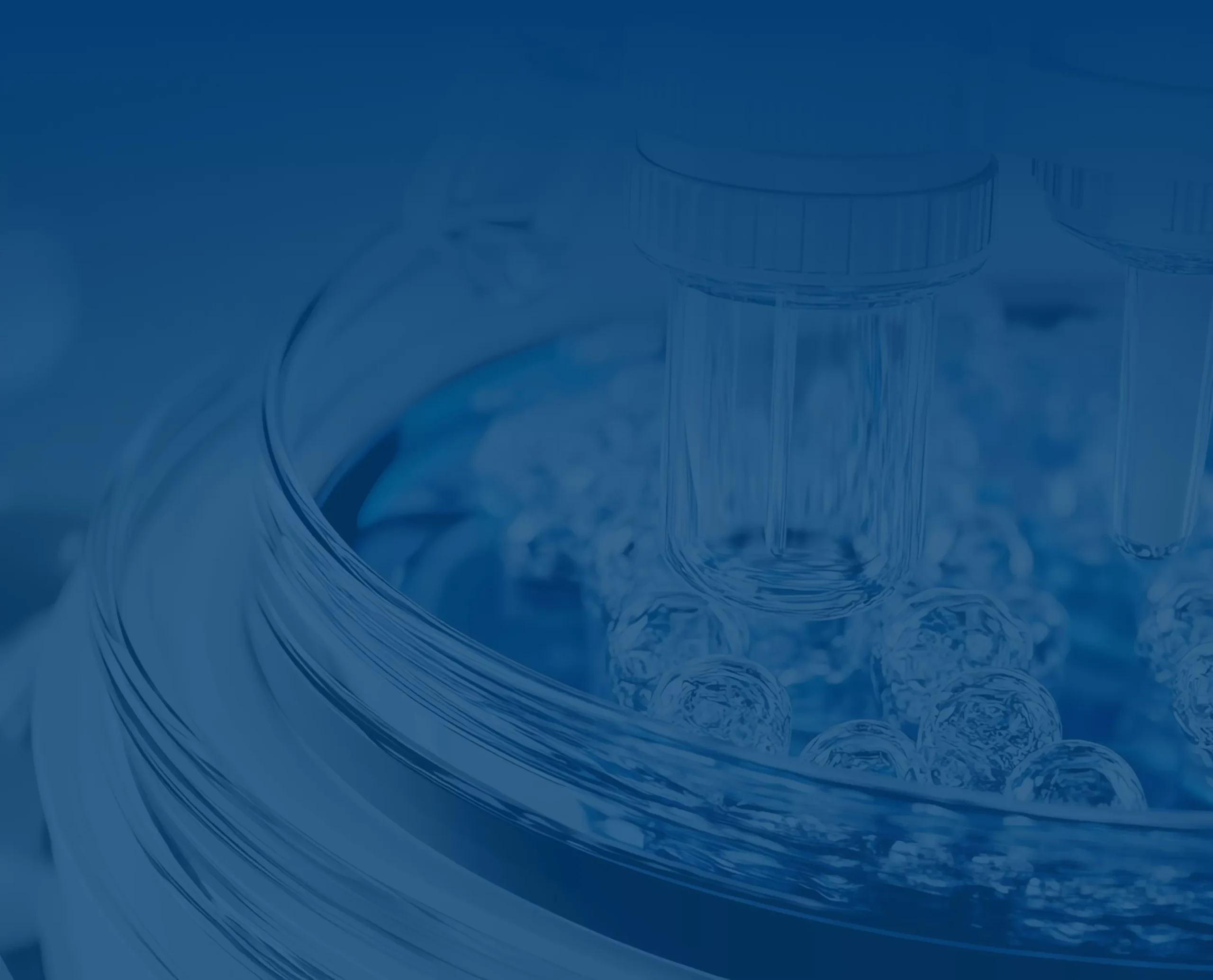 A close-up, blue-toned image of scientific glassware, featuring vials placed in a dish filled with clear, spherical beads, suggesting a laboratory or research setting.